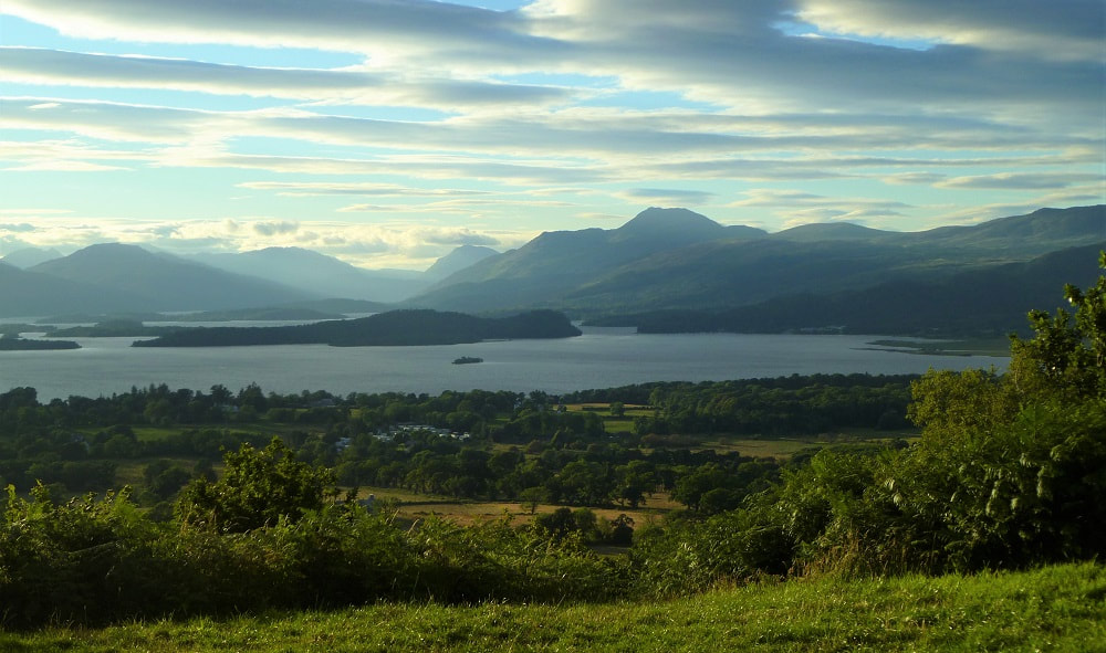 A viewpoint overlooking Loch Lomond with surrounding hills